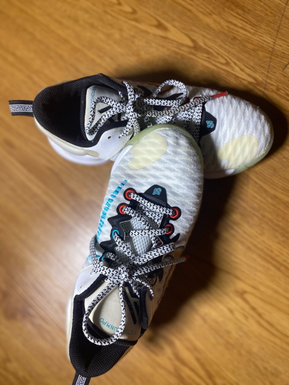 Nike White Athletic Sneakers with Black, Teal & Red Accents